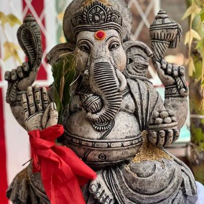 Placing a New Ganesha Statue in School Shrine Room 